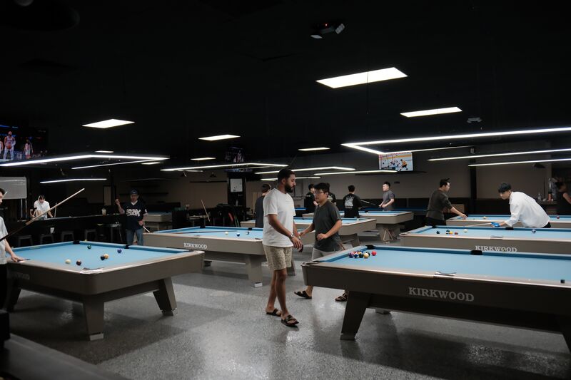 Players walking between Kirkwood-branded tables during opening week