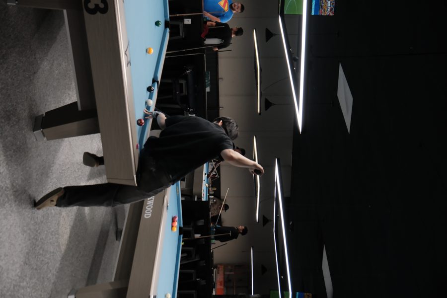 Bar area at Kirkwood Billiards with players and drinks visible