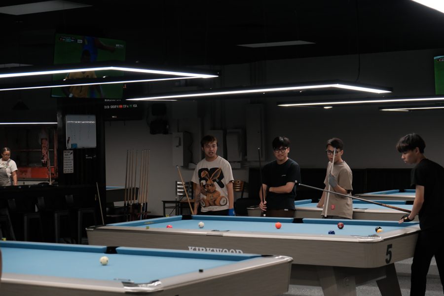 Wide shot with multiple tables in action and community feel
