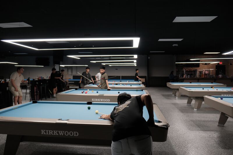 Player lining up a shot on a Kirkwood table
