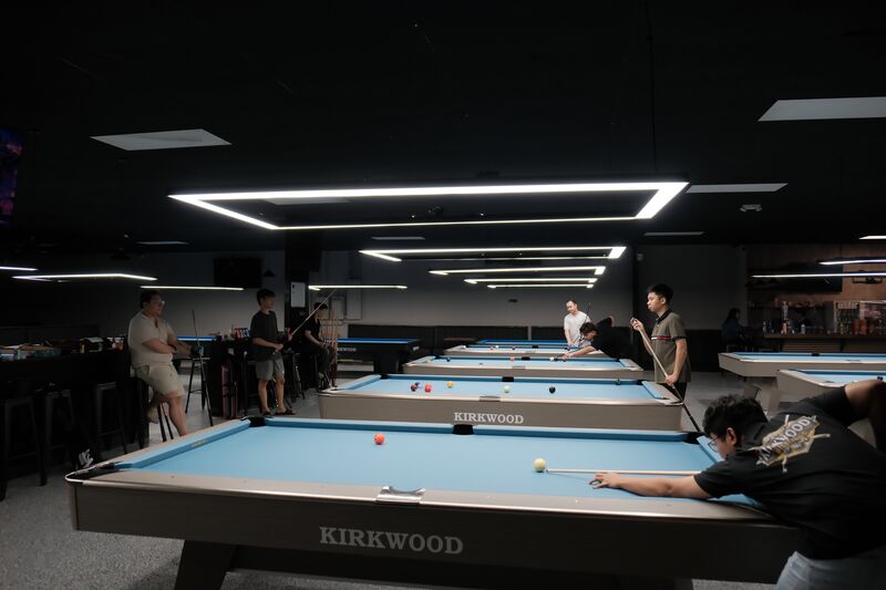 Signature ceiling lighting over rows of tables
